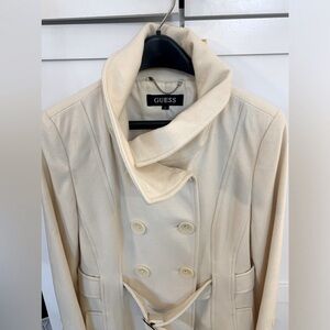 GUESS Wool Coat with Sash
Cream color. Size Small
Pockets and stand up collar.